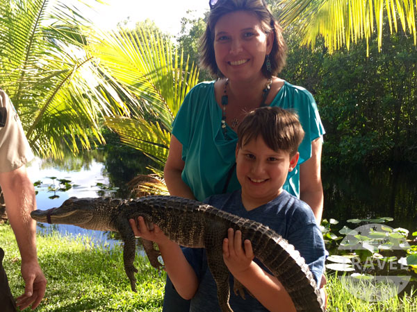 holding an alligator